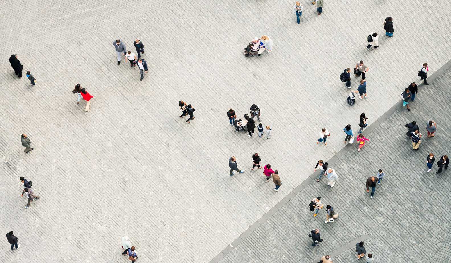 Overhead view of people walking in open area