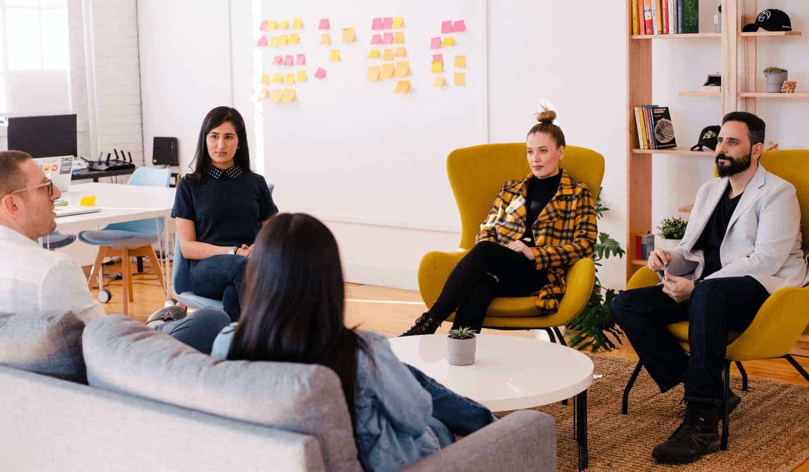 small group sitting in a room engaged in discussion