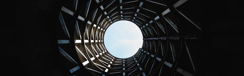 An image of light at the end of a cylindrical tunnel representing path to demand generation