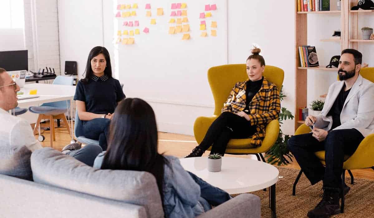 people sitting talking in a circle