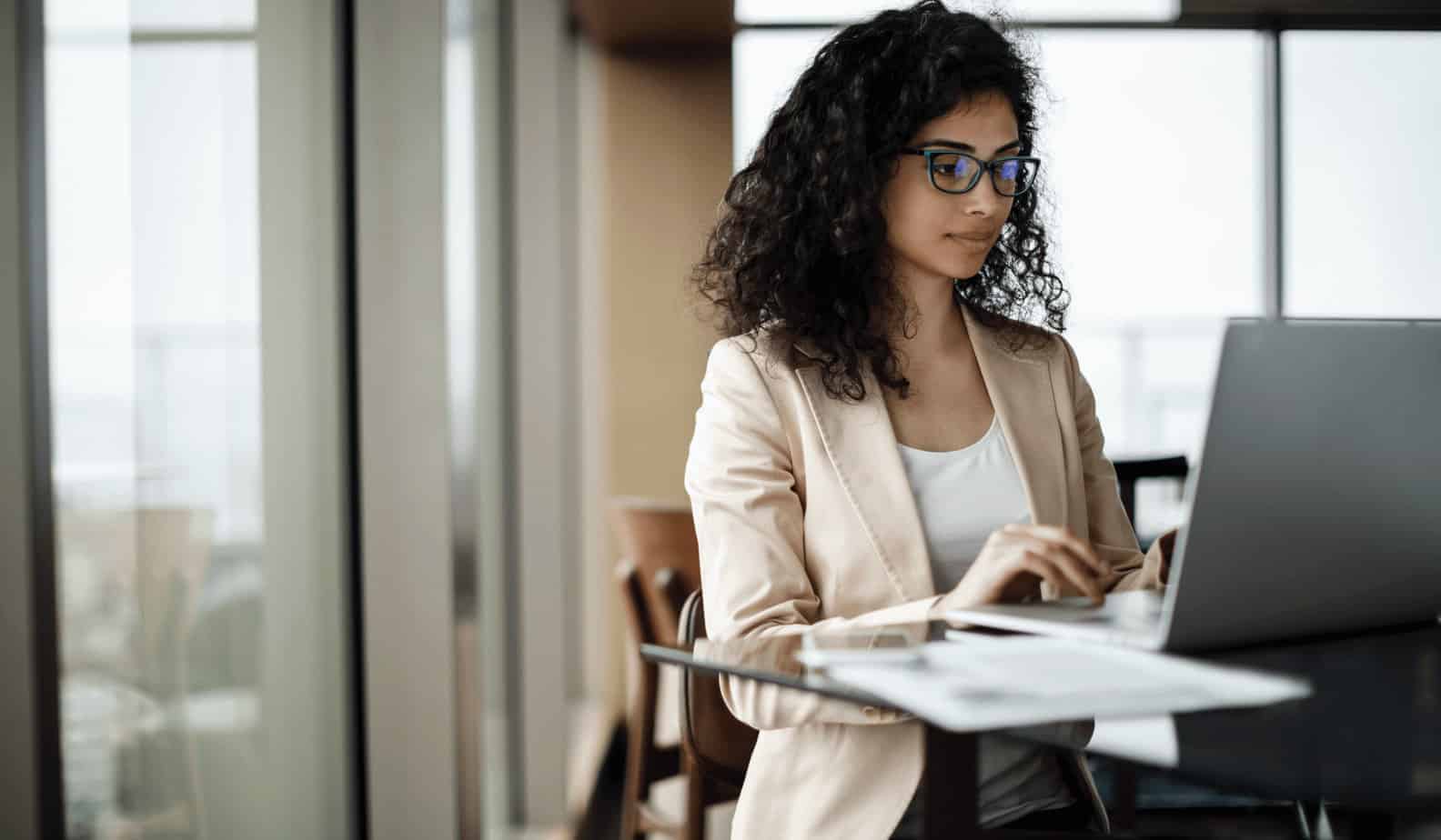 Business woman focused on working on computer