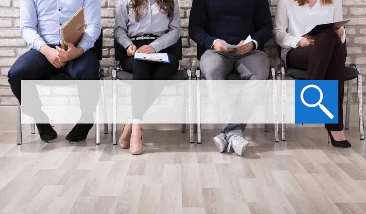 search bar over four people sitting in chairs