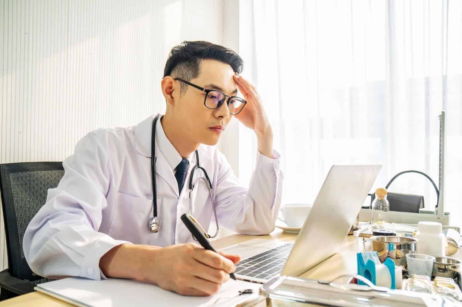 doctor looking at computer