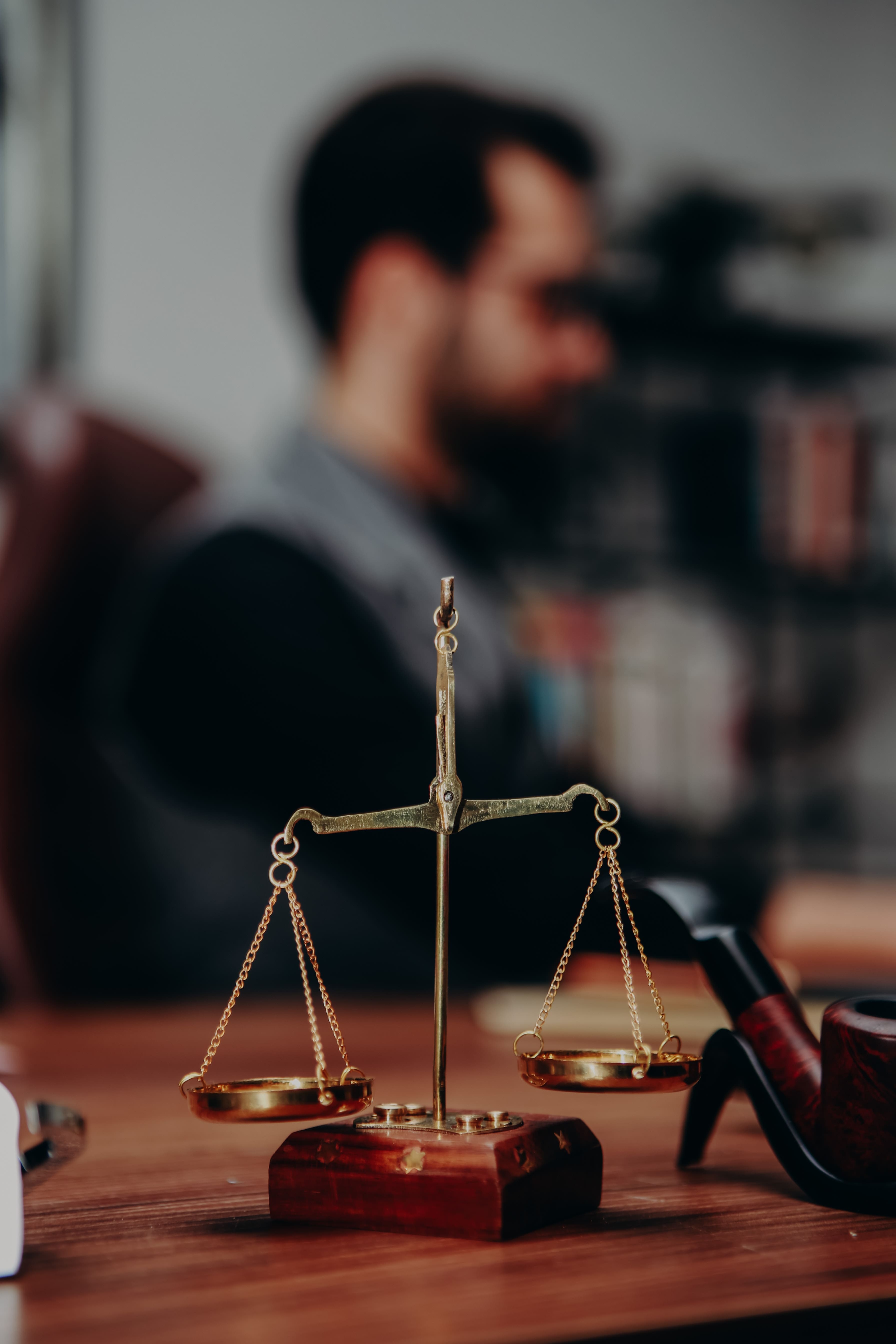 A closeup of a small scale on a lawyers desk