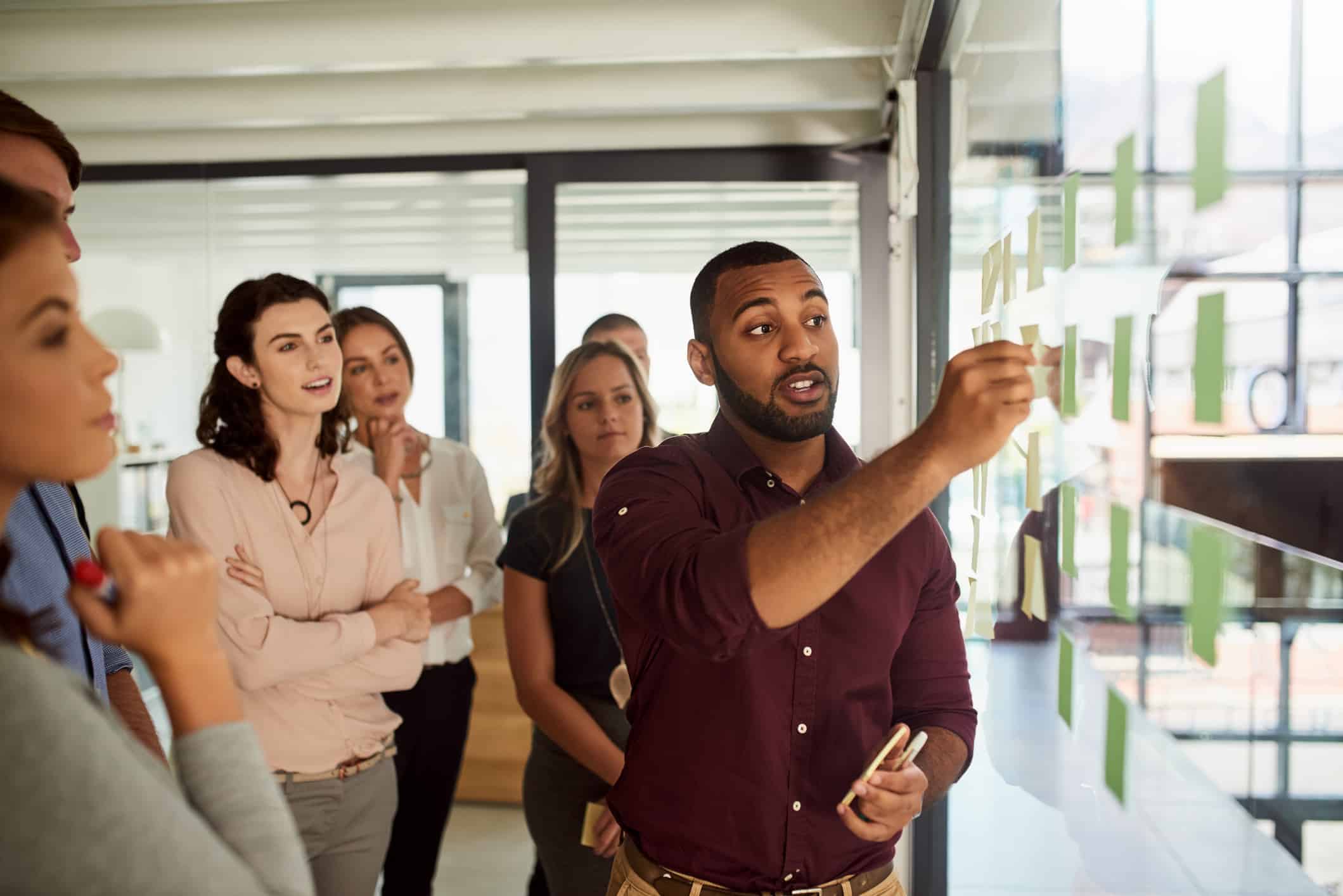 Shot of a young businessman leading a brainstorming session with his colleagues in an office