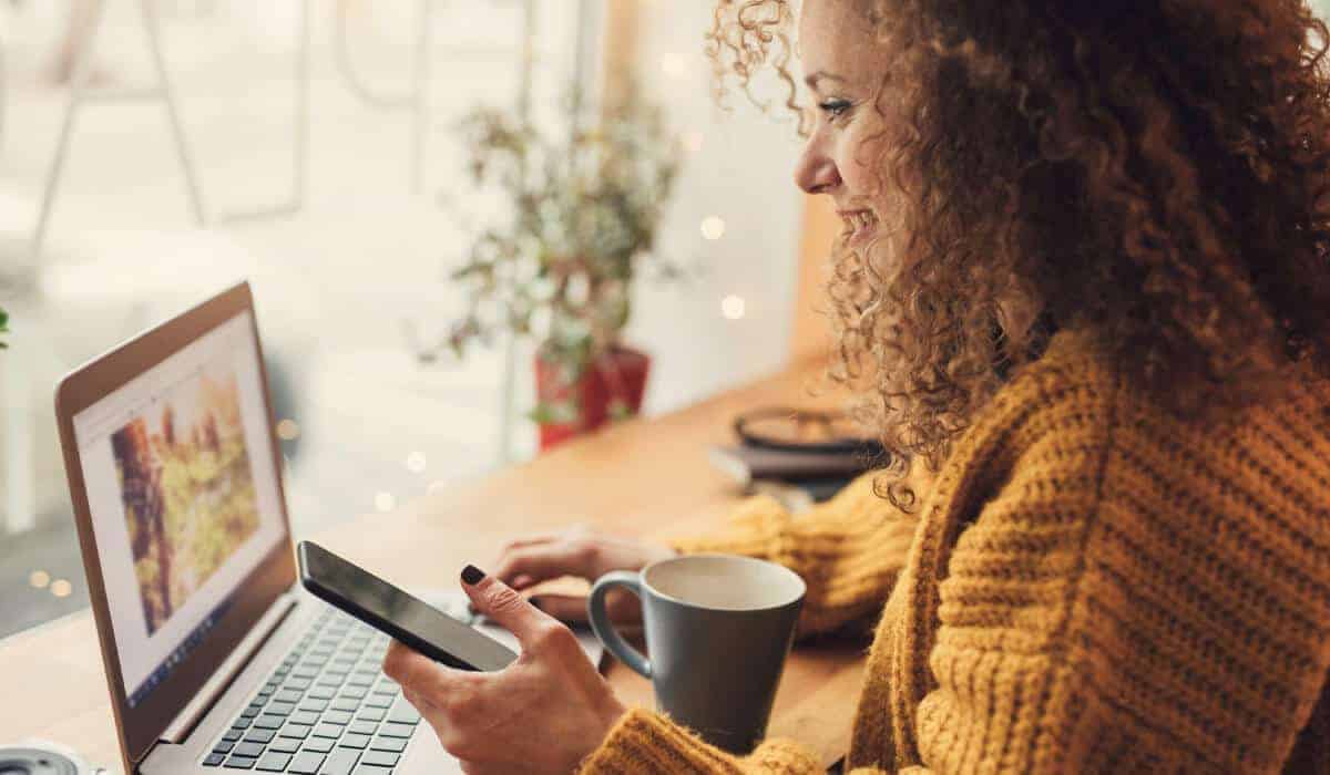 girl looking at her computer smiling