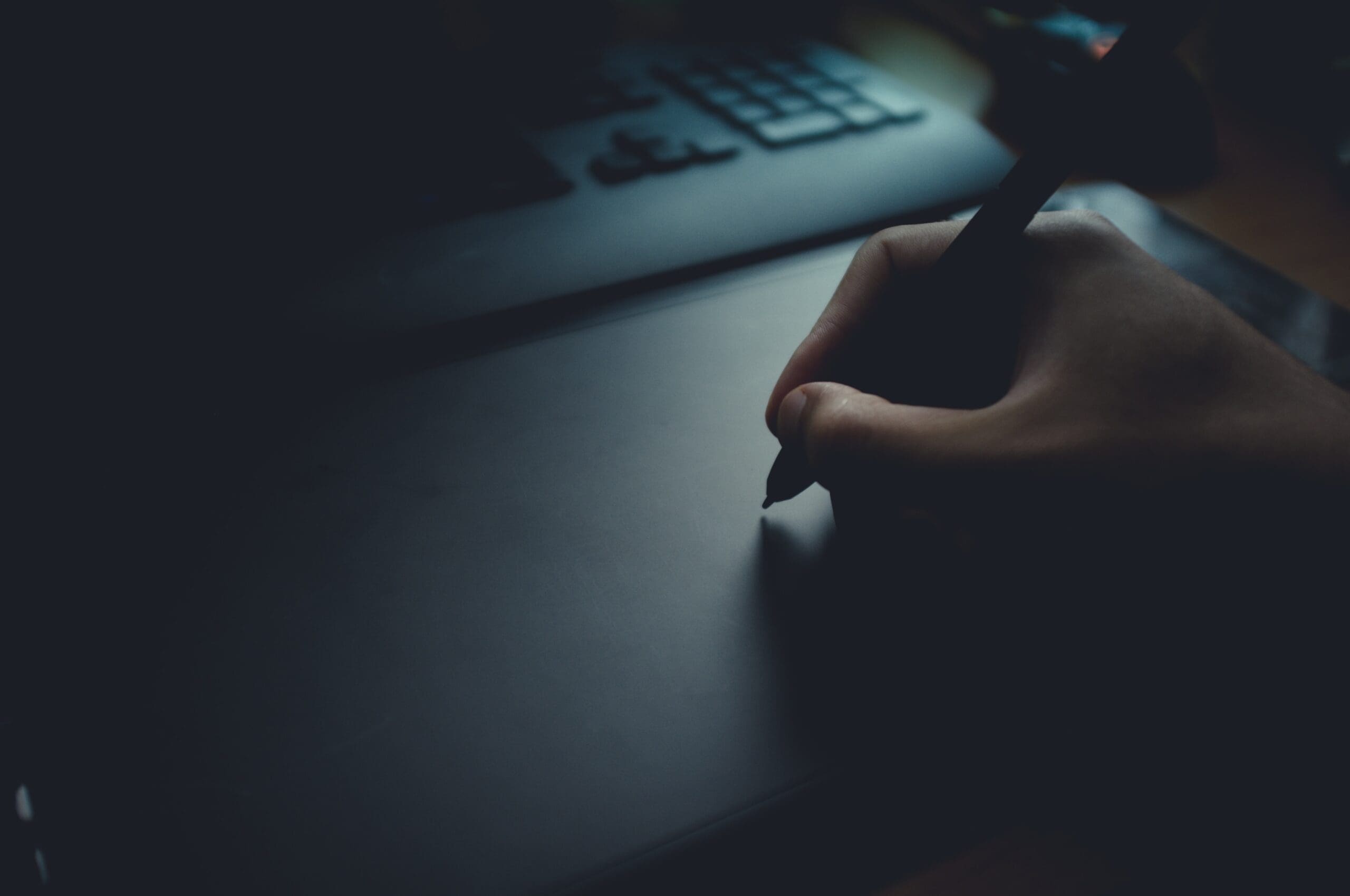 Hand writing on a dark desk