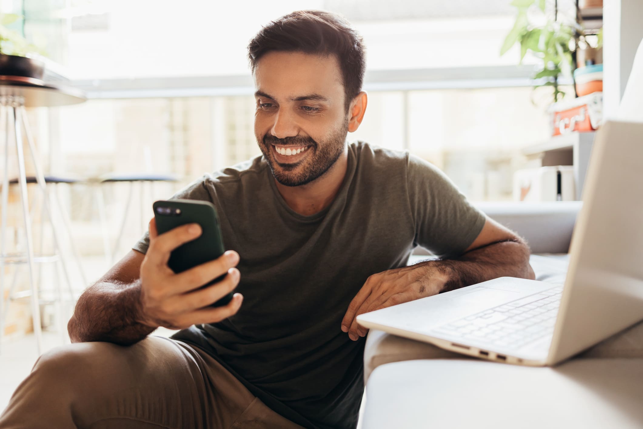 Man smiling at a phone