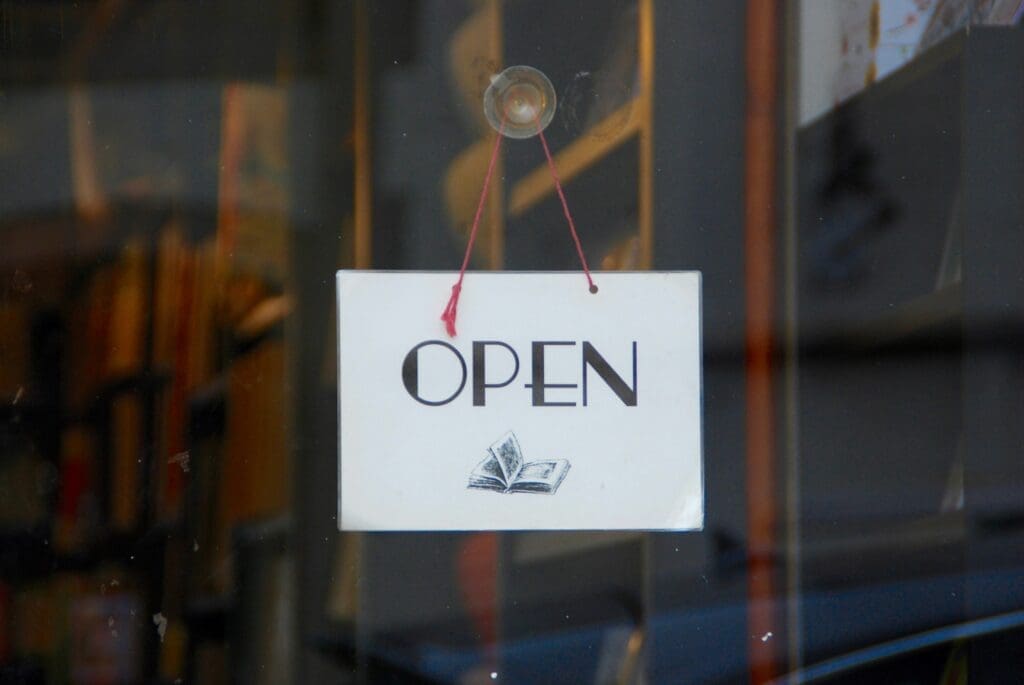 Open sign on the front door of a store